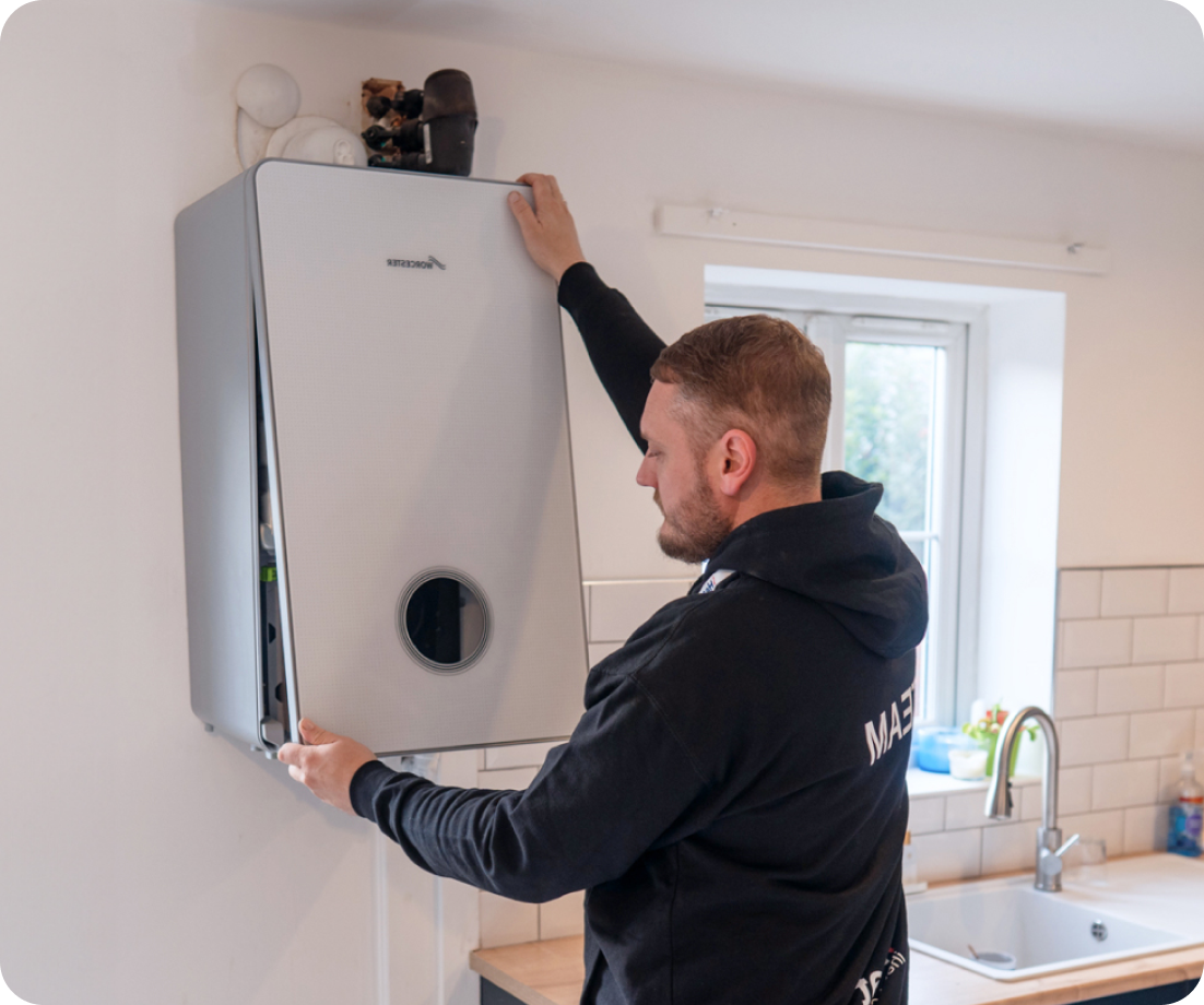Gas Safe engineer installing boiler
