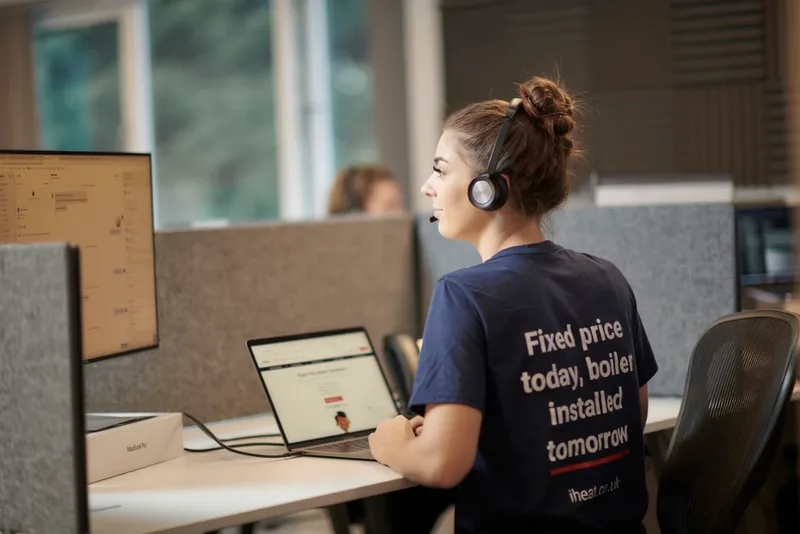 An iHeat adviser helping customers from the office