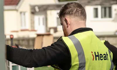 An iHeat installer working at a home