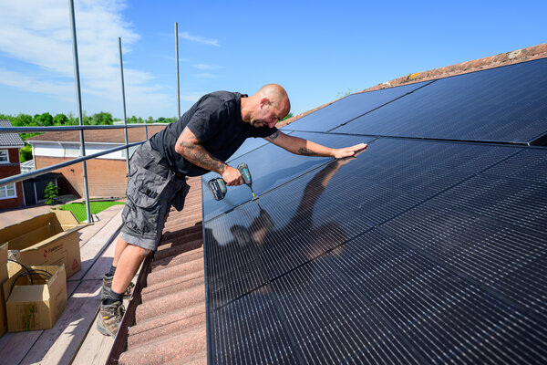 MCS certified solar installer at work