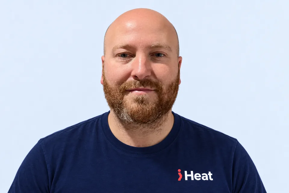 Liam, iHeat engineer, wearing a navy iHeat T-shirt