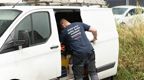 An iHeat engineer preparing equipment at the van